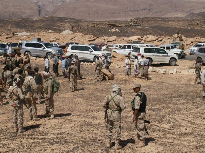Yemeni soldiers re-group after taking control of a major Al-Qaeda stronghold Azzan in the southern province of Shabwa, on May 8, 2014. Yemen's army seized control of Azzan as an offensive against militants entered its tenth day, the defence ministry announced. AFP PHOTO / STR
