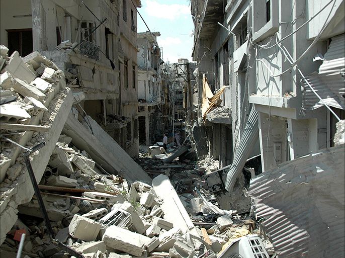 A picture taken on May 10, 2014 shows heavily damaged buildings in the Juret al-Shayah district of the central city of Homs, a day after the last Syrian rebels left the city's neighbourhood under an evacuation deal that hands the government a symbolic victory. Rebel forces in the Old City were under government siege for nearly two years before the deal to evacuate, and regime troops shelled the area almost daily throughout. AFP PHOTO / STR