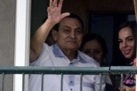 Former Egyptian president Hosni Mubarak, waves to his supporters from his room at the Maadi Military Hospital in Cairo, Egypt, 04 May 2014. Mubarak's supporters had gathered to celebrate his 86th birthday. EPA/MOHAMED HISHAM / ALMASRY ALYOUM EGYPT OUT