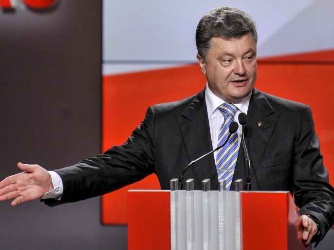 Ukrainian presidential candidate Petro Poroshenko speaks during his press conference in Kiev, Ukraine, Sunday, May 25, 2014. An exit poll showed that billionaire candy-maker Petro Poroshenko won Ukraine's presidential election outright Sunday in the first round — a vote that authorities hoped would unify the fractured nation. (AP Photo/Mykola Lazarenko, Pool)