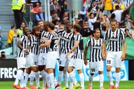 Juventus' Andrea Pirlo (2-L) celebrates with his teammates after scoring the opening goal during the Italian Serie A soccer match between Juventus FC and Cagliari Calcio at the Juventus Stadium in Turin, Italy, 18 May 2014.