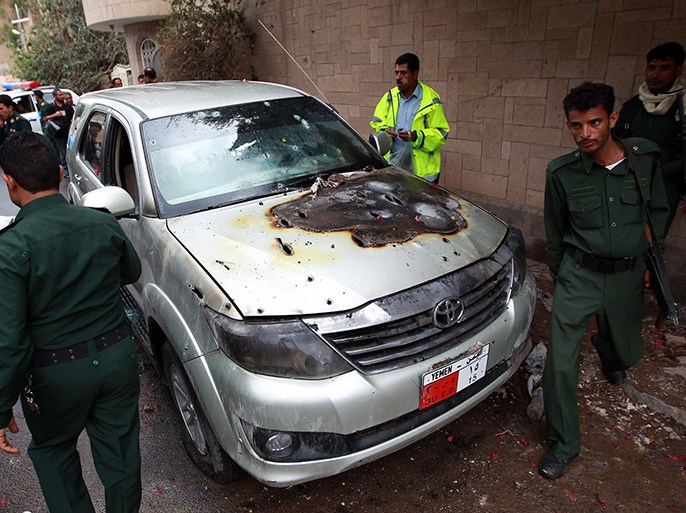 Yemeni soldiers inspect a bullet riddled car which was used by staff from the French embassy after it was attacked by gunmen on May 5, 2014 in Sanaa's diplomatic district of Hada, leaving one French guard dead and another one wounded. Yemeni authorities have launched an investigation into the attack, which took place a few hundred metres (yards) from the French embassy, said the official, who could not immediately provide details on possible motives. AFP