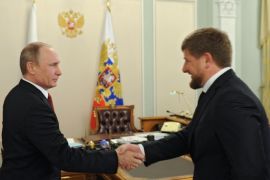 Russia's President Vladimir Putin (L) shakes hands with Chechnya's head Ramzan Kadyrov during their meeting in the Novo-Ogaryovo residence outside Moscow, on April 7, 2014. Ukraine was threatened yesterday with disintegration as pro-Kremlin militants seized government buildings in the eastern city of Donetsk, declared independence and vowed to vote on joining Russia. The activists proclaimed the creation of a 'people's republic' and appealed to Putin to send a 'peacekeeping contingent of the Russian army' to support them. AFP PHOTO / RIA-NOVOSTI / POOL/ MIKHAIL KLIMENTYEV