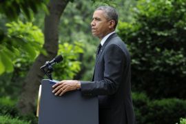 President Barack Obama pauses while speaking about the future of US troops in Afghanistan, Tuesday, May 27, 2014, in the Rose Garden of the White House in Washington. The president will seek to keep 9,800 US troops in Afghanistan after the war formally ends later this year and then will withdraw most of those forces by the end of 2016. (AP Photo/Susan Walsh)