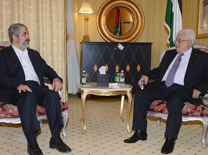 A handout picture released by the Palestinian Press Office (PPO) shows Palestinian leader Mahmud Abbas (R) meeting with political bureau head of Hamas, Khaled Meshaal on May 5, 2014 in Doha, Qatar for the first time since their rival movements signed a surprise unity deal. The last time the two leaders met face-to-face was in Cairo in January 2013. AFP