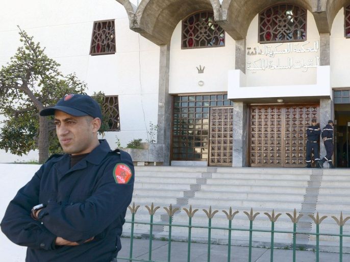 Moroccan policemen stand on guard duty outside the court in Rabat, Morocco February 9, 2013 as a military tribunal in tries 24 Sahrawis who are accused of killing members of the security forces in the Western Sahara in 2010