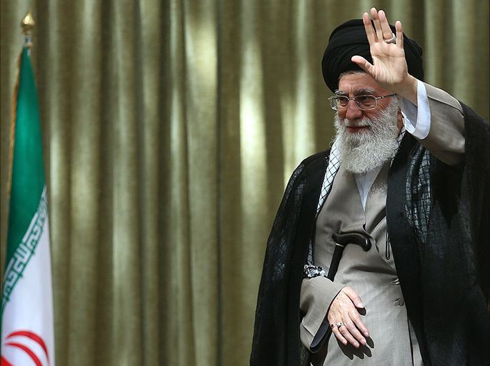 A handout picture released by the official website of the Iranian supreme leader Ayatollah Ali Khamenei shows him waving after delivering a speech on the 25th anniversary of the death of the late founder of the Islamic Republic Ayatollah Ruhollah Khomeini, at the latter's mausoleum in a suburb of Tehran on June 4, 2014