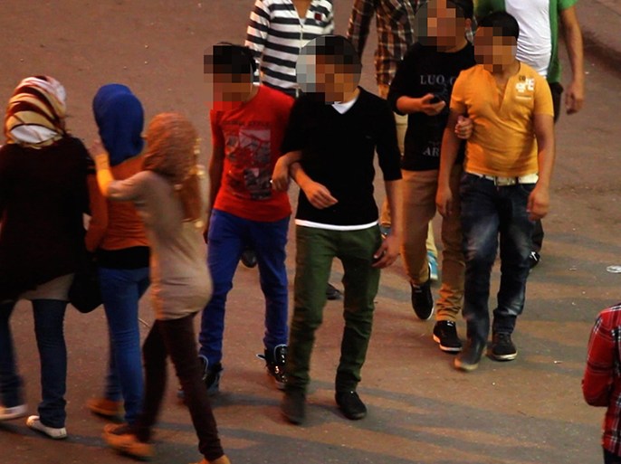 In this undated image made from video released by the producers of "Awel el Kheit" or "the Thread" which airs on the private TV station ONTV, a group of young men harass three girls in Cairo, Egypt, during a segment of an investigative story on sexual harassment. While not new to Egypt’s conservative society, sexual harassment has grown increasingly violent and visible in the nation, which has an embattled police force and an absence of legislation to address it. Egyptian law defines and criminalizes assault, but not sexual harassment.(AP Photo)
