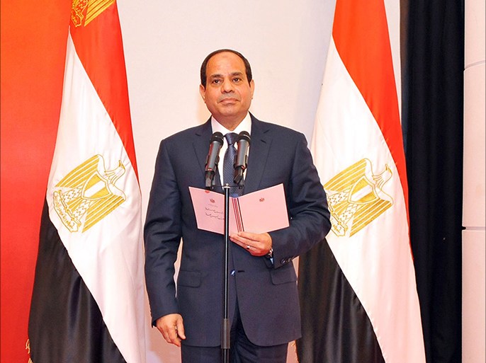 President-elect Abdel Fattah al-Sisi is seen during his swearing-in as president in front of Egypt's interim head of state Adly Mansour and constitutional court members in Cairo June 8, 2014 in this handout provided by The Egyptian Presidency. Former army chief Sisi was sworn in as president of Egypt on Sunday in a ceremony with low-key attendance by Western allies concerned by a crackdown on dissent since he ousted Islamist leader Mohamed Mursi last year. REUTERS/The Egyptian Presidency/Handout via Reuters (EGYPT - Tags: POLITICS TPX IMAGES OF THE DAY) NO SALES. NO ARCHIVES. FOR EDITORIAL USE ONLY. NOT FOR SALE FOR MARKETING OR ADVERTISING CAMPAIGNS. THIS IMAGE HAS BEEN SUPPLIED BY A THIRD PARTY. REUTERS IS UNABLE TO INDEPENDENTLY VERIFY THE AUTHENTICITY, CONTENT, LOCATION OR DATE OF THIS IMAGE. IT IS DISTRIBUTED, EXACTLY AS RECEIVED BY REUTERS, AS A SERVICE TO CLIENTS