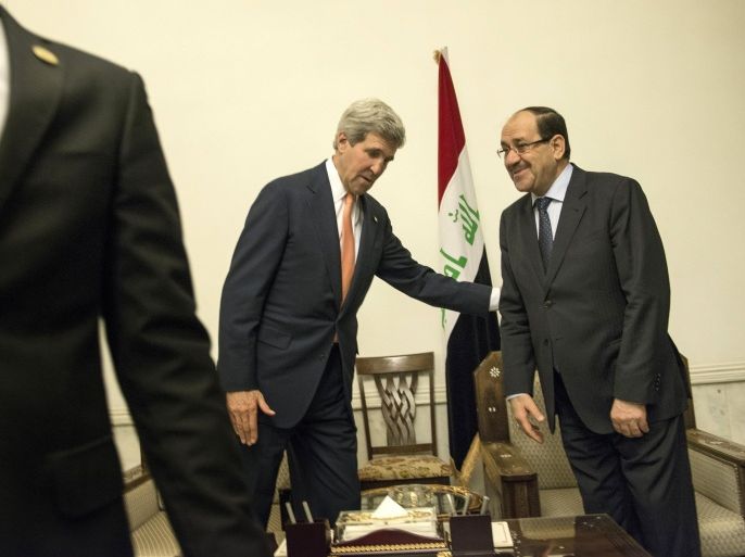 Iraqi Prime Minister Nuri al-Maliki (R) and US Secretary of State John Kerry meet at the Prime Minister's Office in Baghdad on June 23, 2014. Kerry was in Baghdad to push for Iraqi unity and stability, as Sunni militants swept through western towns abandoned by the security forces. AFP PHOTO/POOL/BRENDAN SMIALOWSKI