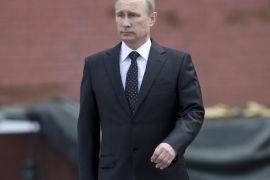In this photo taken on Sunday, June 22, 2014, Russian Vladimir Putin takes part in a wreath laying ceremony at the Tomb of the Unknown Soldier outside Moscow's Kremlin Wall, in Moscow, Russia, to mark the 73rd anniversary of the Nazi invasion of the Soviet Union. Russian news agencies say President Vladimir Putin has asked parliament to cancel a resolution that sanctions the use of military force in Ukraine. Putin wrote to the head of parliament's upper house asking that a March 1 request authorizing the use of force in neighboring Ukraine be withdrawn. (AP Photo/Alexander Zemlianichenko)
