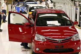 Employees attend a training session at the assembly line of compact car ETIOS at the new plant of Japanese automaker Toyota Motor Corporation in Sorocaba, 100km (62 miles) west of Sao Paulo, in this August 9, 2012 file photo. Growth in Brazil's car market has screeched to a halt, but it is way too late for automakers to hit the brakes. While domestic sales retreat and exports plunge, Brazilian factories are adding over a million vehicles of new capacity in just a few years, racing toward a competitive crunch in the world's fourth biggest auto market. To match Analysis BRAZIL-AUTOS/ REUTERS/Paulo Whitaker (BRAZIL - Tags: TRANSPORT BUSINESS)