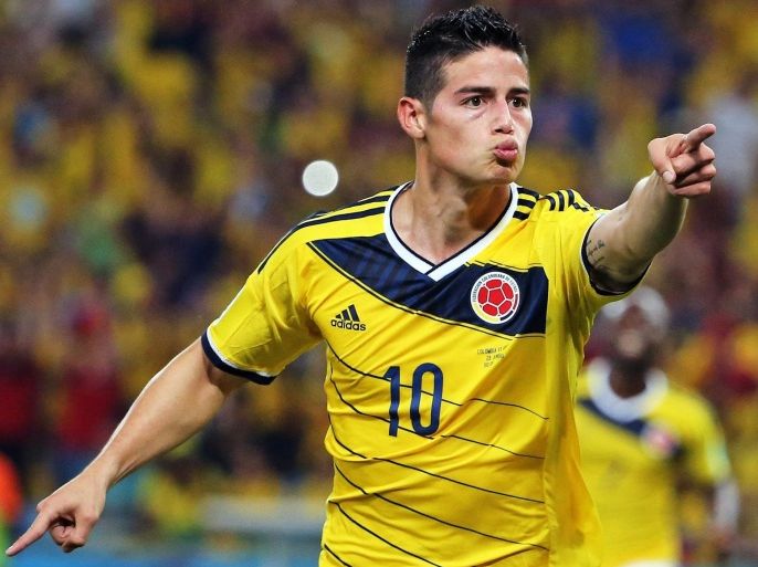 Colombia's James Rodriguez celebrates one of his goals during the FIFA World Cup 2014 round of 16 match between Colombia and Uruguay at the Estadio do Maracana in Rio de Janeiro, Brazil, 28 June 2014. (RESTRICTIONS APPLY: Editorial Use Only, not used in association with any commercial entity - Images must not be used in any form of alert service or push service of any kind including via mobile alert services, downloads to mobile devices or MMS messaging - Images must appear as still images and must not emulate match action video footage - No alteration is made to, and no text or image is superimposed over, any published image which: (a) intentionally obscures or removes a sponsor identification image; or (b) adds or overlays the commercial identification of any third party which is not officially associated with the FIFA World Cup)