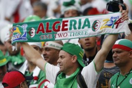 Fans of Algeria cheer before the group H World Cup soccer match between Algeria and Russia at the Arena da Baixada in Curitiba, Brazil, Thursday, June 26, 2014. (AP Photo/Jon Super)