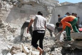 This photo provided by the anti-government activist group Syrian Observatory for Human Rights, which has been authenticated based on its contents and other AP reporting, shows Syrians inspecting the rubble of a destroyed houses following a Syrian government airstrike in Aleppo, Syria, Wednesday, June. 25, 2014. Syrian government warplanes on Wednesday struck a series of targets in a northern city that is a stronghold of an al-Qaida splinter group, killing and wounding several people, opposition activists said. (AP Photo/Syrian Observatory for Human Rights)