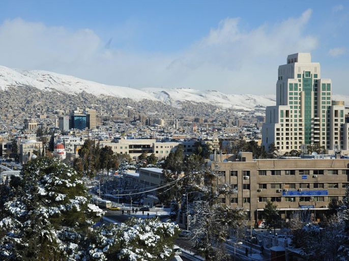 A picture taken on January 10, 2013 shows of general view of the Syrian capital of Damascus after heavy snow falls. Snow carpeted Syria's war-torn cities but sparked no let-up in the fighting, instead heaping fresh misery on a civilian population already enduring a chronic shortage of heating fuel and daily power cuts. مدينة دمشق