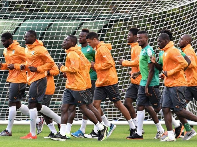 Ivory Coast players run during a training session in Aguas de Lindoia on June 20, 2014, during the 2014 FIFA World Cup in Brazil. AFP PHOTO / ISSOUF SANOGO