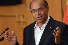 Tunisian President Moncef Marzouki speaks during a ceremony to unveil the 'truth and dignity commission' on June 9, 2014, in the capital Tunis. The commission formed to identify and compensate victims abused under decades of dictatorship, is made up of human rights activists, representatives of victim groups, opponents of Ben Ali and judges, and is tasked iswith identifying voluntary homicide, rape, extrajudicial killings and torture, as well as economic crimes and corruption. AFP PHOTO/FETHI BELAID