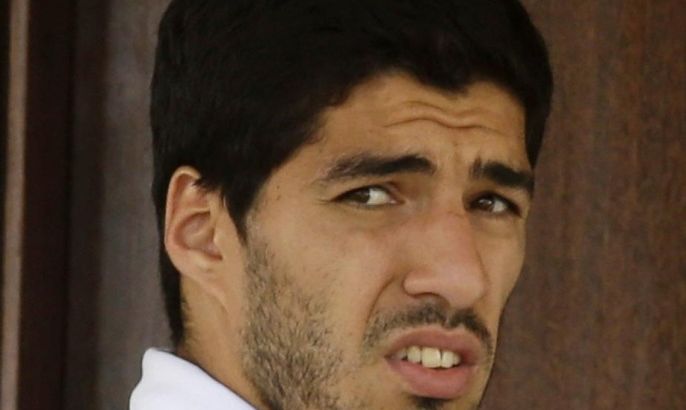 Uruguay's Luis Suarez looks out from his hotel in Natal, Brazil, Wednesday, June 25, 2014. On Thursday, June 26, 2014, FIFA banned Suarez for 9 games and 4 months for biting an opponent at the World Cup. (AP Photo/Hassan Ammar)
