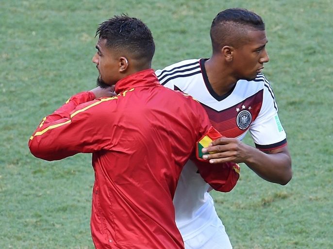 Germany's defender Jerome Boateng (back) embraces his brother Ghana's forward Kevin-Prince Boateng prior to a Group G football match between Germany and Ghana at the Castelao Stadium in Fortaleza during the 2014 FIFA World Cup on June 21, 2014. AFP PHOTO/ EMMANUEL DUNAND