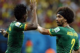 Benjamin Moukandjo of Cameroon (L) and Benoit Assou-Ekotto of Cameroon argue during the FIFA World Cup 2014 group A preliminary round match between Cameroon and Croatia at the Arena Amazonia in Manaus, Brazil, 18 June 2014. (RESTRICTIONS APPLY: Editorial Use Only, not used in association with any commercial entity - Images must not be used in any form of alert service or push service of any kind including via mobile alert services, downloads to mobile devices or MMS messaging - Images must appear as still images and must not emulate match action video footage - No alteration is made to, and no text or image is superimposed over, any published image which: (a) intentionally obscures or removes a sponsor identification image; or (b) adds or overlays the commercial identification of any third party which is not officially associated with the FIFA World Cup) EPA/JEON HEON-KYUN