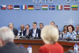 NATO Secretary General Anders Fogh, center, gives opening remarks during the start of a meeting of the North Atlantic Council at NATO headquarters in Brussels, June 3, 2014. NATO defense ministers are gathering for the first time since the Ukraine crisis, and top of the agenda is how to react long term to Russia's new military capabilities and its willingness to use them. (AP Photo/Pablo Martinez Monsivais, Pool)