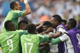 Nigeria's Ahmed Musa, center celebrates with his teammates after scoring his side's second goal during the group F World Cup soccer against Argentina at the Estadio Beira-Rio in Porto Alegre, Brazil, Wednesday, June 25, 2014. (AP Photo/Martin Meissner)