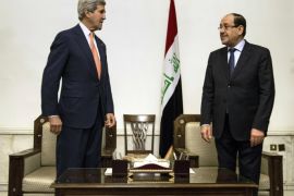 U.S. Secretary of State John Kerry, left, meets with Iraqi Prime Minister Nouri al-Maliki, right, at the Prime Minister's office in Baghdad on Monday, June 23, 2014. Kerry flew to Baghdad on Monday to meet with Iraq's leaders and personally urge the Shiite-led government to give more power to political opponents before a Sunni insurgency seizes more control across the country and sweeps away hopes for lasting peace. (AP Photo/Brendan Smialowski, Pool)