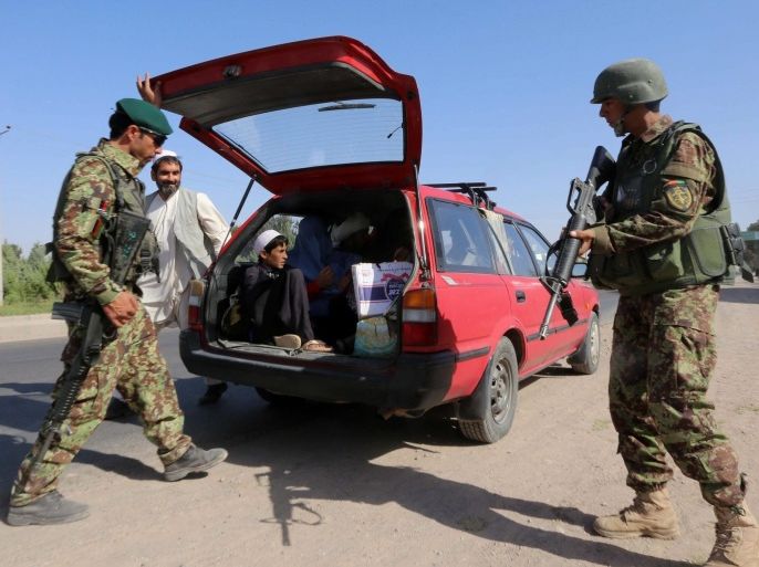 Afghan security forces check vehicles on a roadside during the second round of Presidential election, in Herat, Afghanistan, 12 June 2014. Taliban militants on 02 June threatened to target the second round of voting in Afghanistan's presidential election, warning people to stay away from polling stations. The two lead candidates in the first round of voting - Abdullah Abdullah and Ashraf Ghani - are competing in a run-off on 14 June.