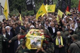 Hezbollah fighters carry the coffin of fellow Shiite militant Qusai Ali Amro, killed in fighting alongside government forces in Syria, during his funeral in the Mount Lebanon village of Maaysra, east of the Christian coastal town of Byblos, on May 26, 2014. Hezbollah has sent thousands of fighters into Syria to support President Bashar al-Assad's forces against rebels seeking his overthrow, saying they are defending an 'axis of resistance' against Israel and the West. AFP PHOTO/STR