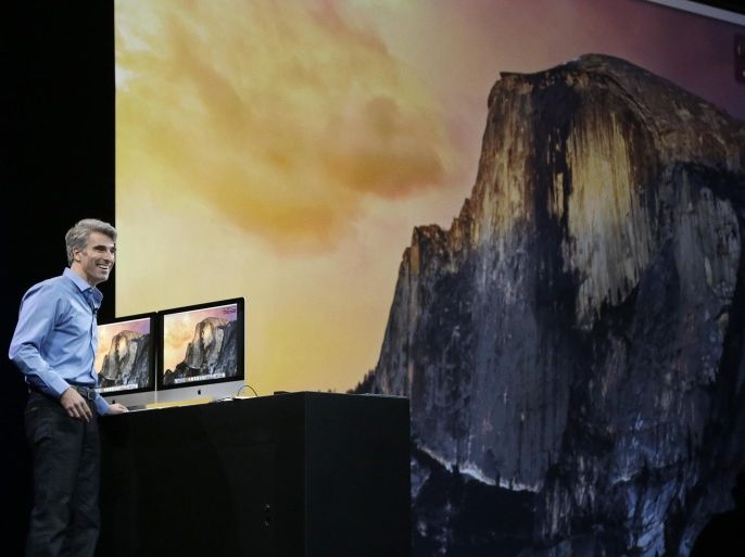 Apple senior vice president of Software Engineering Craig Federighi speaks in front of a screen for the Yosemite operating system at the Apple Worldwide Developers Conference in San Francisco, Monday, June 2, 2014. (AP Photo/Jeff Chiu)