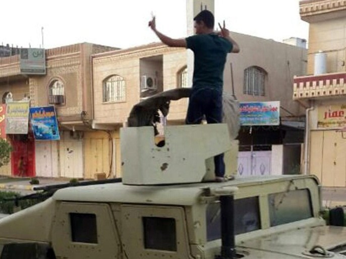 Iraqi boys ride an armored military vehicle at a street in Tikrit, northern Iraq, 11 June 2014. There were conflicting claims as to the fate of Salah al-Din's provincial capital Tikrit, with state television quoting security officials as saying they had retaken it from militants of the Islamic State in Iraq and the Levant (ISIL). Iraq's air force went into action against militants who have seized a swathe of the north including the country's second largest city Mosul, state television reported. Alsumaria television earlier reported that ISIL had seized the city, 170 kilometres north of Baghdad. EPA/STR BEST QUALTY AVAILABLE