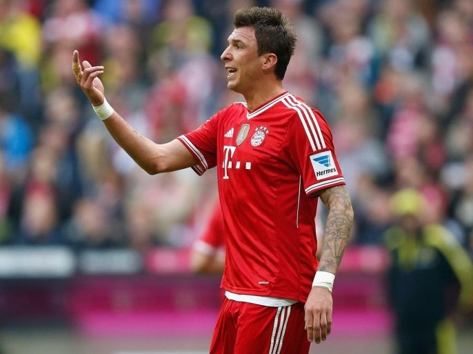 MUNICH, GERMANY - APRIL 12: Mario Mandzukic of Muenchen gestures during the Bundesliga match between FC Bayern Muenchen and BVB Borussia Dortmund at Allianz Arena on April 12, 2014 in Munich, Germany.