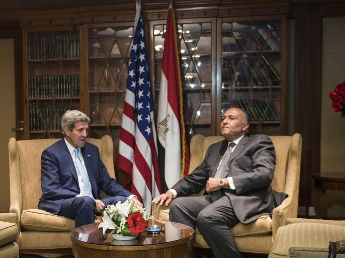 U.S. Secretary of State John Kerry, left, meets with Egyptian Foreign Minister Sameh Hassan Shoukry in Cairo, Egypt Sunday, June 22, 2014. Kerry arrived Sunday in the Egyptian capital to meet with Egyptian officials including President Abdel-Fattah el-Sissi in the highest-level American outreach since he took office. The United States is moving forward with attempts to thaw relations with Egypt that have cooled over concerns that the government in Cairo has conducted sham trials, imprisoned journalists and issued a violent crackdown on its political enemies. (AP Photo/Brendan Smalowski, Pool)