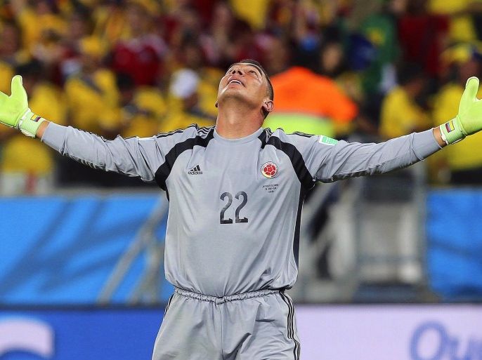 Colombia's goalkeeper Faryd Mondragon celebrates during the FIFA World Cup 2014 group C preliminary round match between Japan and Colombia at the Arena Pantanal in Cuiaba, Brazil, 24 June 2014. Colombia won 4-1. (RESTRICTIONS APPLY: Editorial Use Only, not used in association with any commercial entity - Images must not be used in any form of alert service or push service of any kind including via mobile alert services, downloads to mobile devices or MMS messaging - Images must appear as still images and must not emulate match action video footage - No alteration is made to, and no text or image is superimposed over, any published image which: (a) intentionally obscures or removes a sponsor identification image; or (b) adds or overlays the commercial identification of any third party which is not officially associated with the FIFA World Cup) EPA/MAURICIO DUENAS