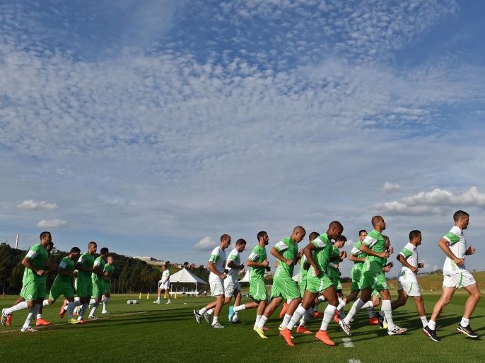 Algeria's footballers run during a training session at the Atletico World Sports Center in Sorocaba, Brazil on June 14, 2014, during the 2014 FIFA World Cup. AFP PHOTO / PHILIPPE DESMAZES