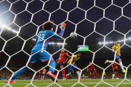 FORTALEZA, BRAZIL - JUNE 17: Guillermo Ochoa of Mexico makes a save after a header by Thiago Silva of Brazil (R) during the 2014 FIFA World Cup Brazil Group A match between Brazil and Mexico at Castelao on June 17, 2014 in Fortaleza, Brazil.