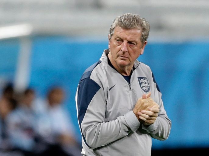 England's manager Roy Hodgson watches his players during a squad training session for the 2014 soccer World Cup at Itaquerao Stadium in Sao Paulo, Brazil, Wednesday, June 18, 2014. Uruguay play England in group D of the 2014 soccer World Cup at the stadium on Thursday. (AP Photo/Matt Dunham)