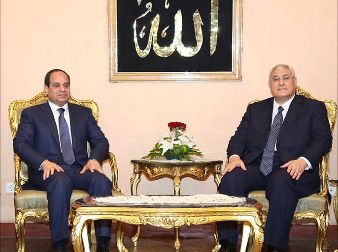 President-elect Abdel Fattah al-Sisi (L) meets with interim head of state Adly Mansour in Cairo June 8, 2014 in this handout provided by The Egyptian Presidency. Former army chief Sisi was sworn in as president of Egypt on Sunday in a ceremony with low-key attendance by Western allies concerned by a crackdown on dissent since he ousted Islamist leader Mohamed Mursi last year. REUTERS/The Egyptian Presidency/Handout via Reuters (EGYPT - Tags: POLITICS TPX IMAGES OF THE DAY) NO SALES. NO ARCHIVES. FOR EDITORIAL USE ONLY. NOT FOR SALE FOR MARKETING OR ADVERTISING CAMPAIGNS. THIS IMAGE HAS BEEN SUPPLIED BY A THIRD PARTY. REUTERS IS UNABLE TO INDEPENDENTLY VERIFY THE AUTHENTICITY, CONTENT, LOCATION OR DATE OF THIS IMAGE. IT IS DISTRIBUTED, EXACTLY AS RECEIVED BY REUTERS, AS A SERVICE TO CLIENTS