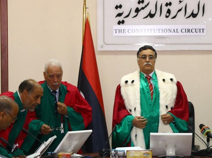 Judges of Libya's supreme court discuss the legitimacy of the prime minister during a hearing on June 9, 2014 in the capital Tripoli. The court ruled that the election of prime minister Ahmed Miitig in a chaotic session in the interim parliament in early May was unconstitutional. AFP PHOTO / MAHMUD TURKIA