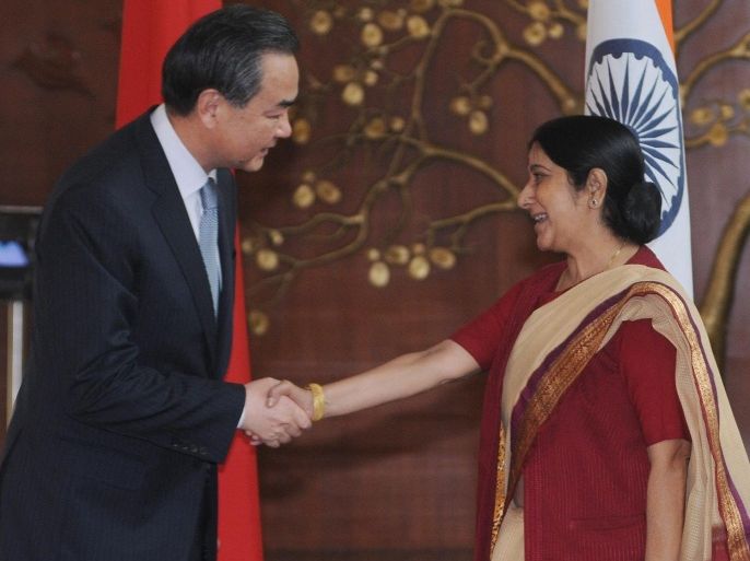 Indian Minister for External Affairs Sushma Swaraj (R), shakes hand with Chinese Foreign Affairs Minister Wang Yi (L), during a meeting in New Delhi, India, 08 June 2014. Wang Yi is on a two-day official visit to India.