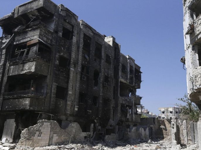 A general view shows damaged buildings in Jobar, a suburb of Damascus July 18, 2014. REUTERS/Bassam Khabieh (SYRIA - Tags: POLITICS CIVIL UNREST CONFLICT)