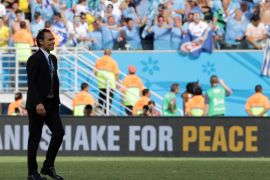 Italy's head coach Cesare Prandelli leaves the pitch after the group D World Cup soccer match between Italy and Uruguay at the Arena das Dunas in Natal, Brazil, Tuesday, June 24, 2014. (AP Photo/Antonio Calanni)