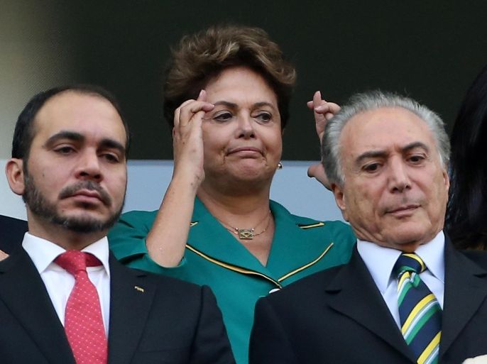 SAO PAULO, BRAZIL - JUNE 12: President of Brazil Dilma Roussef crosses her fingers before the 2014 FIFA World Cup Brazil Group A match between Brazil and Croatia at Arena de Sao Paulol on June 12, 2014 in Sao Paulo, Brazil.