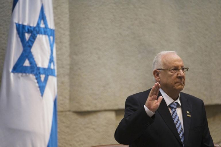 Incoming Israeli President Reuven Rivlin is sworn in during a ceremony at the Knesset, Israel's parliament, in Jerusalem, Thursday, July 24, 2014. Nobel Peace Prize laureate Shimon Peres ended his term as president of Israel on Thursday — a man who symbolizes hopes for peace capping a seven-decade public career amid the brutal reality of war. Peres handed the ceremonial but high-profile presidency over to Reuven Rivlin, a legislator from the hawkish Likud Party. (AP Photo/Ronen Zvulun, Pool)