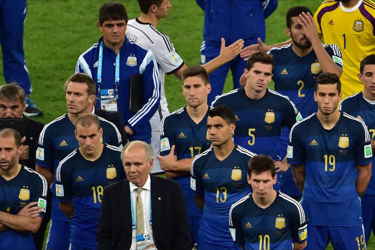 Argentina's coach Alejandro Sabella and Argentina's forward and captain Lionel Messi (R) react after losing the 2014 FIFA World Cup final football match between Germany and Argentina at the Maracana Stadium in Rio de Janeiro on July 13, 2014. AFP