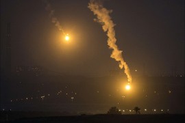 A picture taken from the Israeli Gaza border shows an Israeli army flare illuminating the sky above the Gaza strip on July 17, 2014. Israeli air strikes in Gaza killed four children , medics said, after a humanitarian lull in a 10-day conflict that has killed 237 Palestinians. AFP