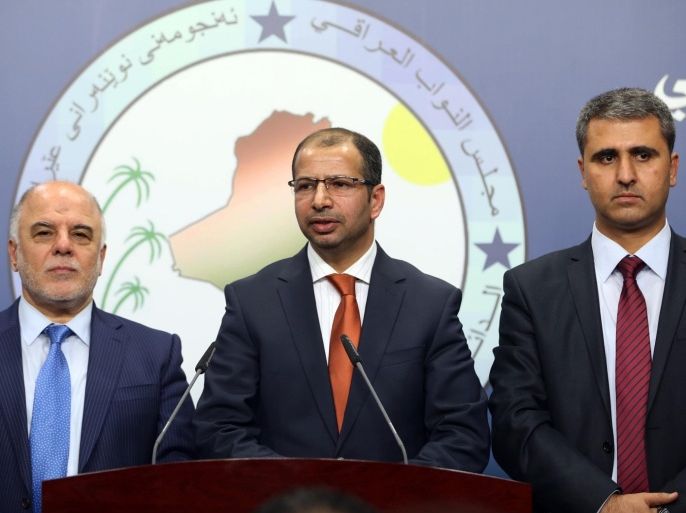 Iraqi new Parliament Speaker Salim al-Jubouri, center, and his deputies, Shiite lawmaker Haider al-Ibadi, left, and Kurdish lawmaker Aram Sheik Mohammed, right, speak to the media after an Iraqi parliament session in Baghdad, Tuesday, July 15, 2014. Iraqi lawmakers broke two weeks of deadlock Tuesday and elected a new speaker of parliament, taking the first step toward forming a new government that is widely seen as crucial to confronting militants who have overrun much of the country. (AP Photo/Hadi Mizban)