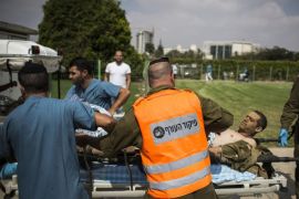 BEER-SHEBA, ISRAEL - JULY 22: An Israeli soldier injured in combat is rushed to the emergecy room as the militery Helicopter lands in Soroka hospital on July 22, 2014 in Beer-sheva, Israel. As operation 'Protective Edge' goes into it's third week, the death toll continues to mount, including 27 Israeli soldiers and over 500 people in Gaza, the vast majority of whom are civilians.