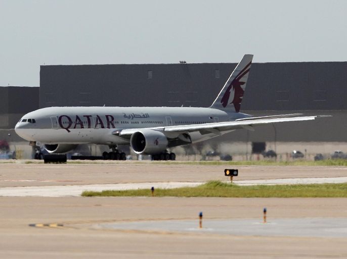 IMAGE DISTRIBUTED FOR QATAR AIRWAYS - A Qatar Airways 777-200 airplane lands, Tuesday, July 1, 2014 at Dallas-Fort Worth International Airport in Texas. The world’s 5-star airline launches non-stop service to DFW, making it the airline's 7th destination in the United States. The new destination opens multiple new options thanks to oneworld alliance. (Brandon Wade/AP Images for Qatar Airways)